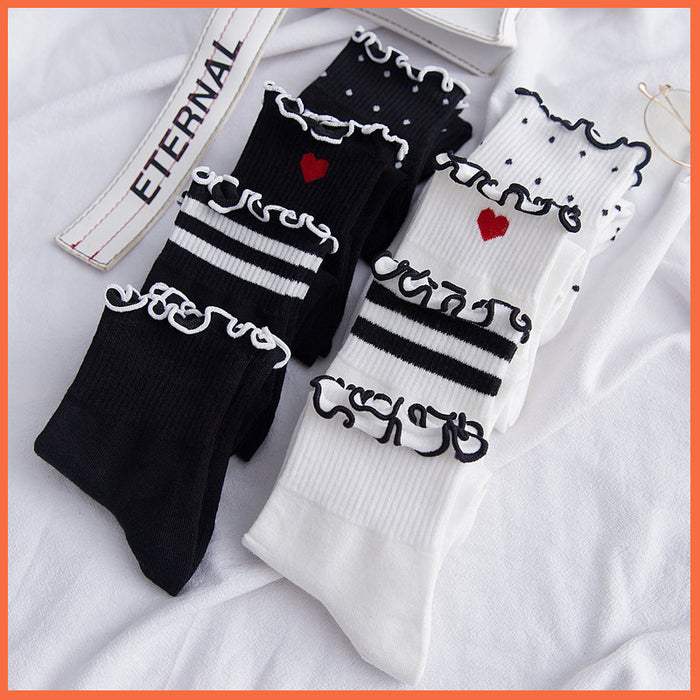 Wholesale Embroidered heart-shaped middle tube socks made of cotton and college style cotton socks