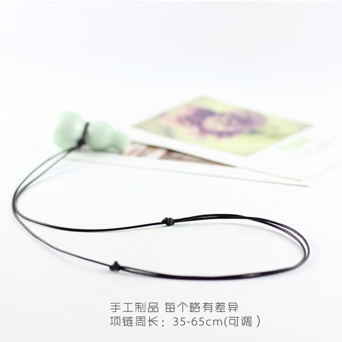 Wholesale Hulu whistle three-dimensional small whistle necklace small pendant ceramic whistle sweater chain necklace pendant
