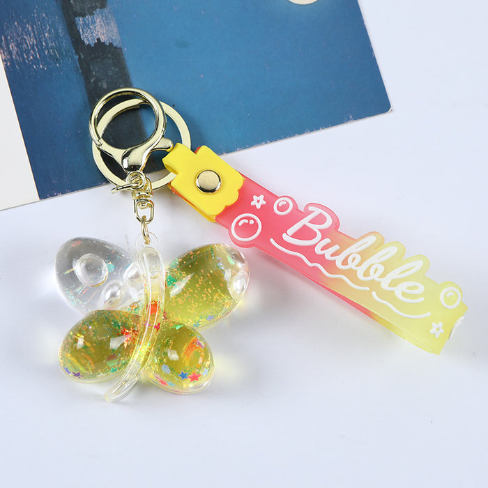 Wholesale Acrylic oil butterfly quicksand keychain bag pendant candy color