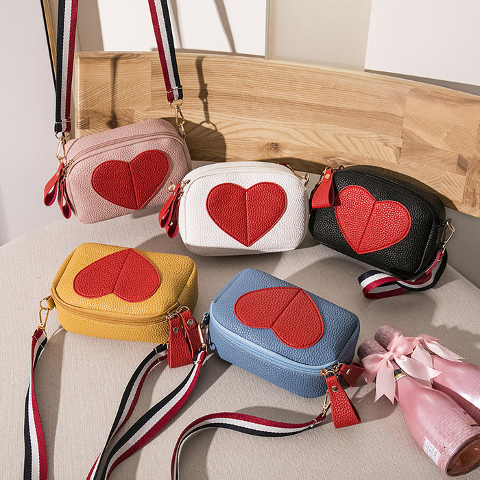 Wholesale Litchi patterned heart-shaped peach women's bag with contrasting ribbon, single shoulder diagonal cross phone bag