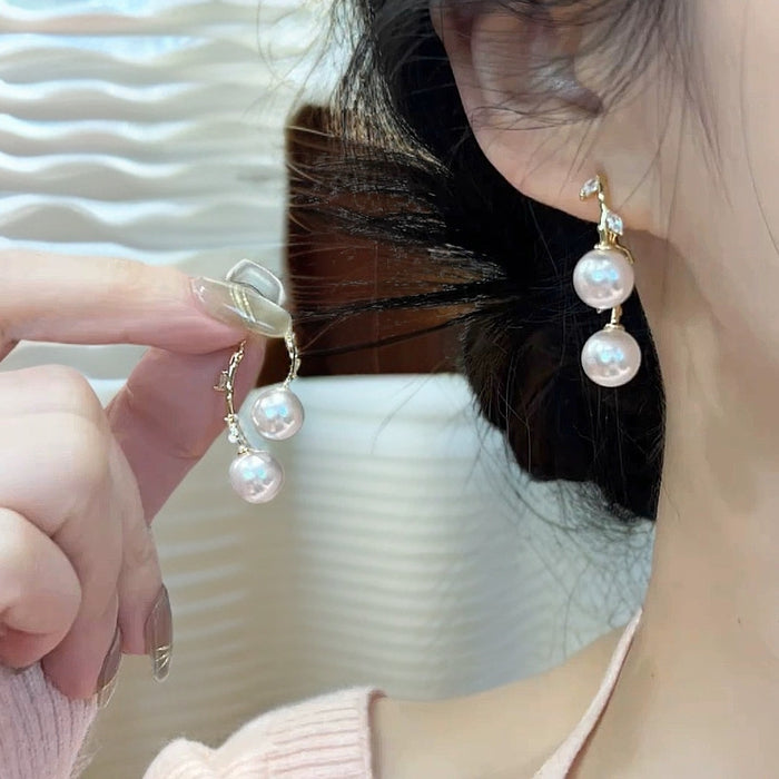 Wholesale A pair of cross leaf pearl earrings with light luxury temperament, fashionable and versatile ear accessories