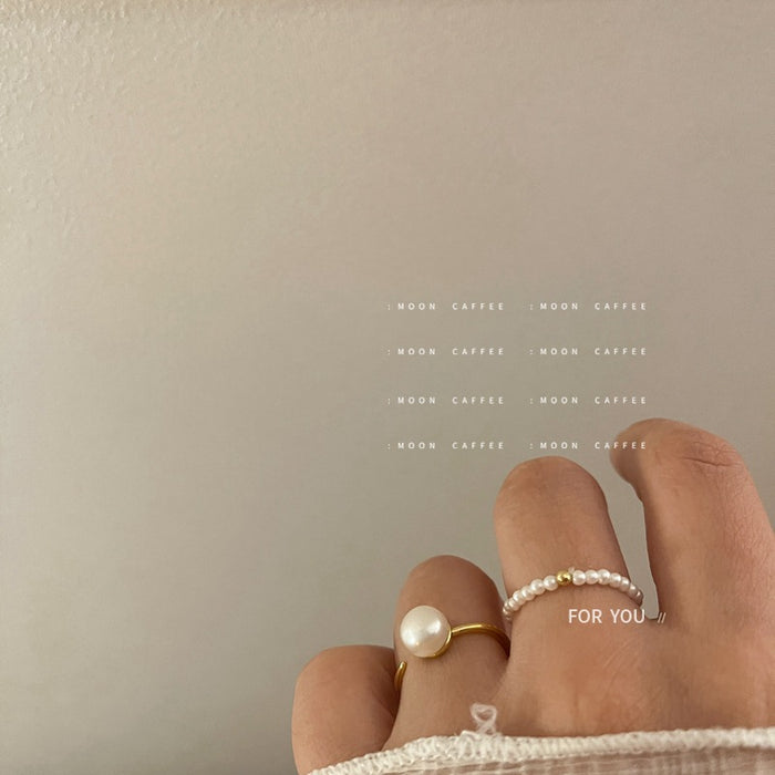 Wholesale Light luxury mini pearl bead elastic rope ring with a retro temperament that does not touch the wrist circumference, freshwater pearl ring