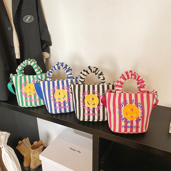 Wholesale Canvas bag, cute smiling face handbag, striped crossbody bag, commuting shoulder bag