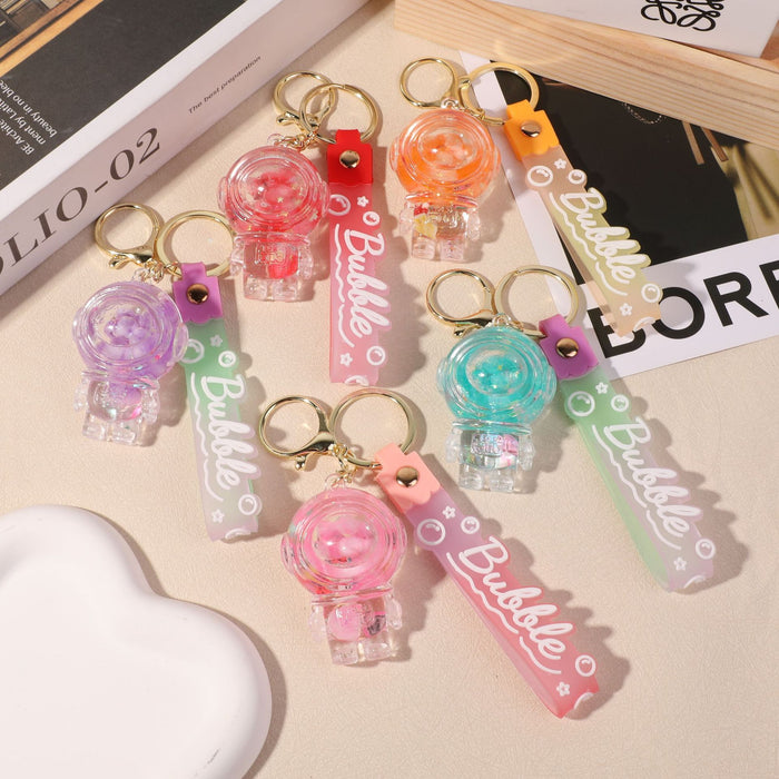 Wholesale Spaceman quicksand bottle acrylic luminous pendant keychain creative birthday gift car key chain pendant