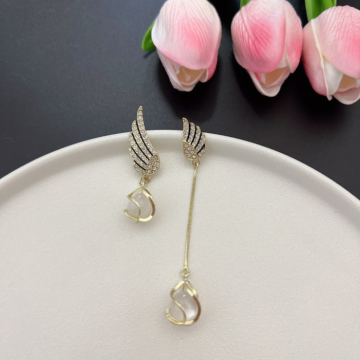 Wholesale Trendy AB asymmetrical diamond studded wing tassel cat eye stone earrings with atmospheric and exquisite earrings