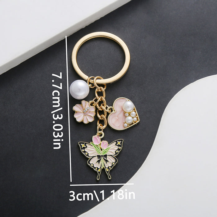 Wholesale Oil-dripping purple heart-shaped pearl tulip flower butterfly metal keychain