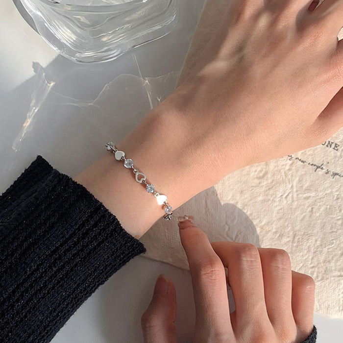 Wholesale Sweet and cool heart-shaped zircon bracelet with niche design, hollowed out heart-shaped bracelet, light luxury and versatile gift