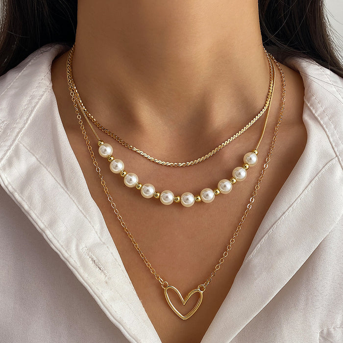 Wholesale Fashionable imitation pearl heart-shaped hollow pendant necklace, exquisite, high-end, versatile, multi-layer stacked collarbone chain