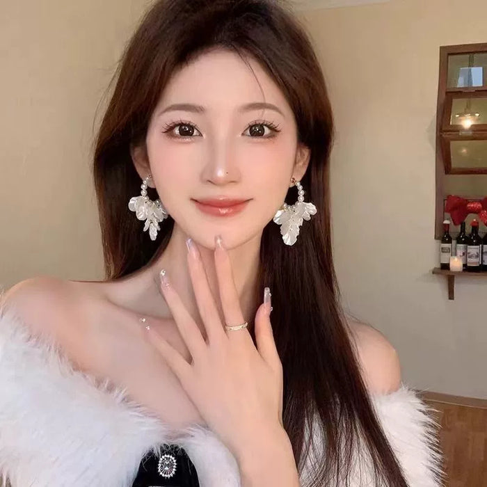 Wholesale Silver needle petal pearl earrings with a light luxury temperament, shell tassel earrings