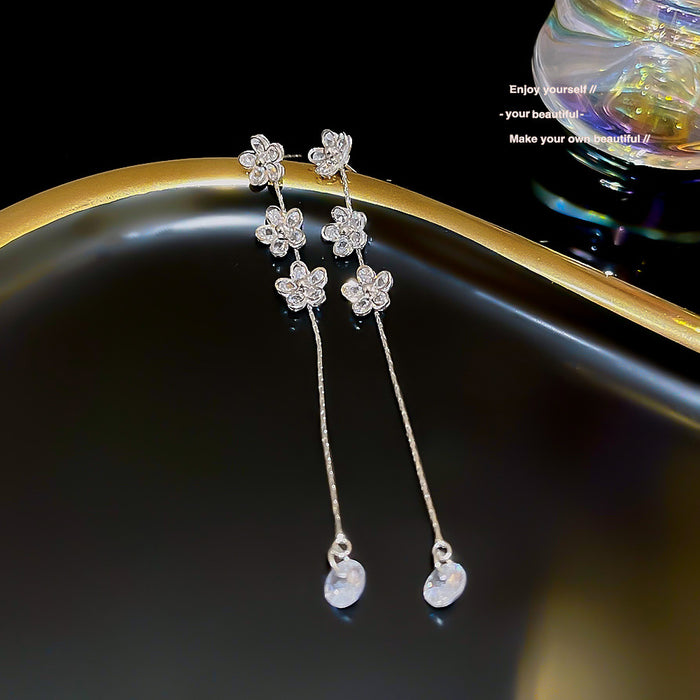Wholesale Temperament long tassel earrings for female niche design, high-end earrings, new copper zircon petal earrings