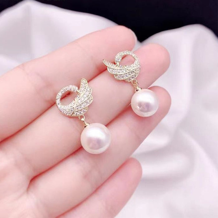 Wholesale Exquisite and elegant diamond studded pearl earrings, high-end and luxurious commuting versatile earrings, stylish and elegant style