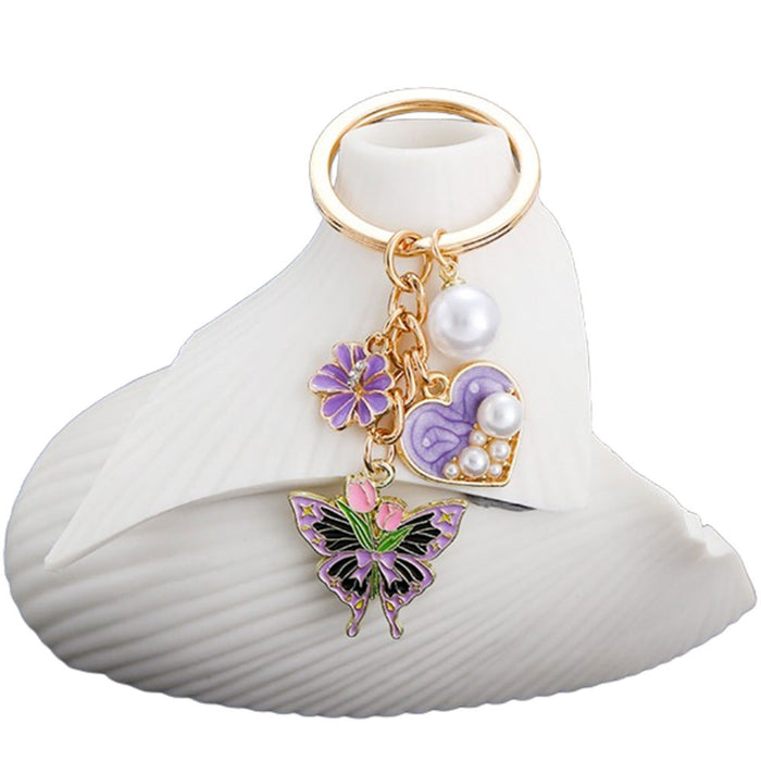 Wholesale Oil-dripping purple heart-shaped pearl tulip flower butterfly metal keychain