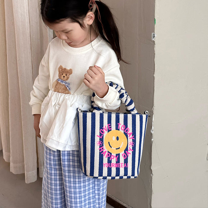 Wholesale Canvas bag, cute smiling face handbag, striped crossbody bag, commuting shoulder bag