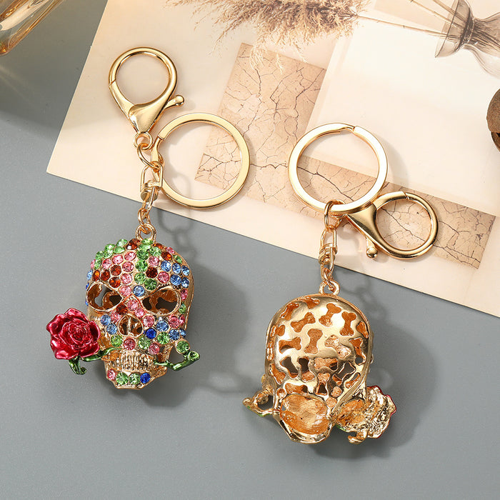 Wholesale Trendy Rhinestone Skull Keychain with Zinc Alloy Bag Charm