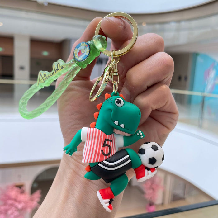 Wholesale Creative new football dinosaur keychain, exquisite and cute soft plastic figurine pendant, bag accessories, small gifts
