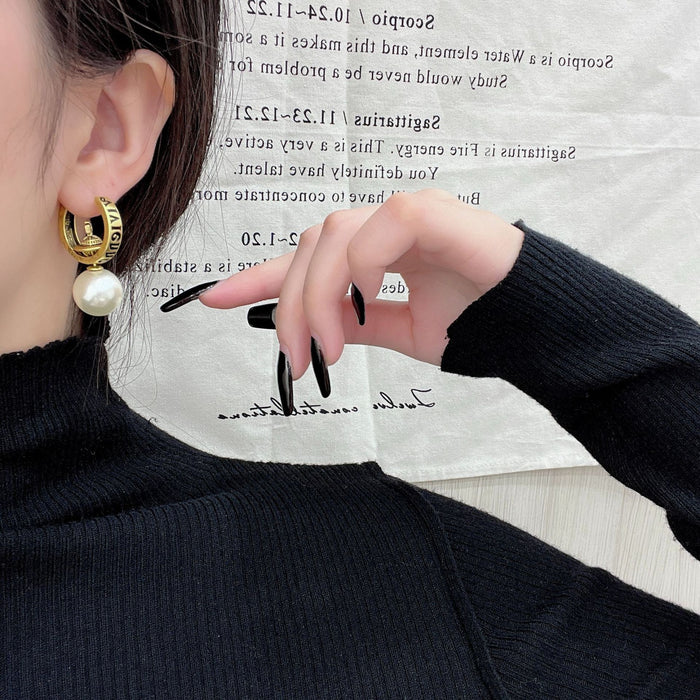 Wholesale medieval vintage distressed Saturn planet pearl ear buckle niche design earrings