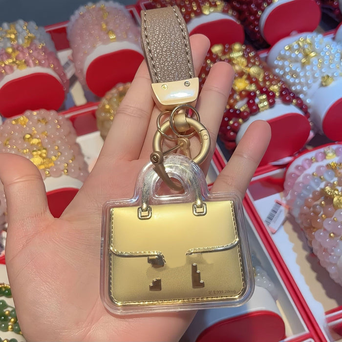 Wholesale Cute gold-colored bag keychain