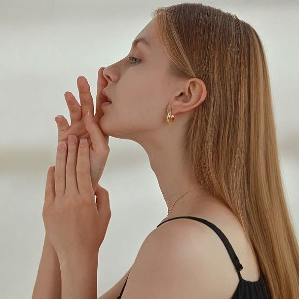 Wholesale Copper plated genuine gold earrings with fashionable and high-end photosensitive surface