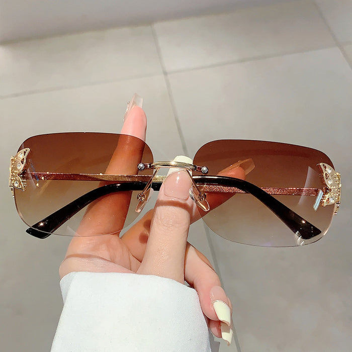 Wholesale Vintage Square Butterfly Decorated Frameless PC Sunglasses JDC-SG-PLS119