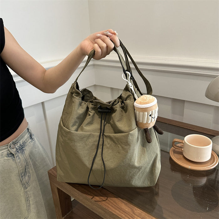 Wholesale Niche casual artistic canvas bucket bag, fashionable drawstring single shoulder pleated nylon crossbody bag