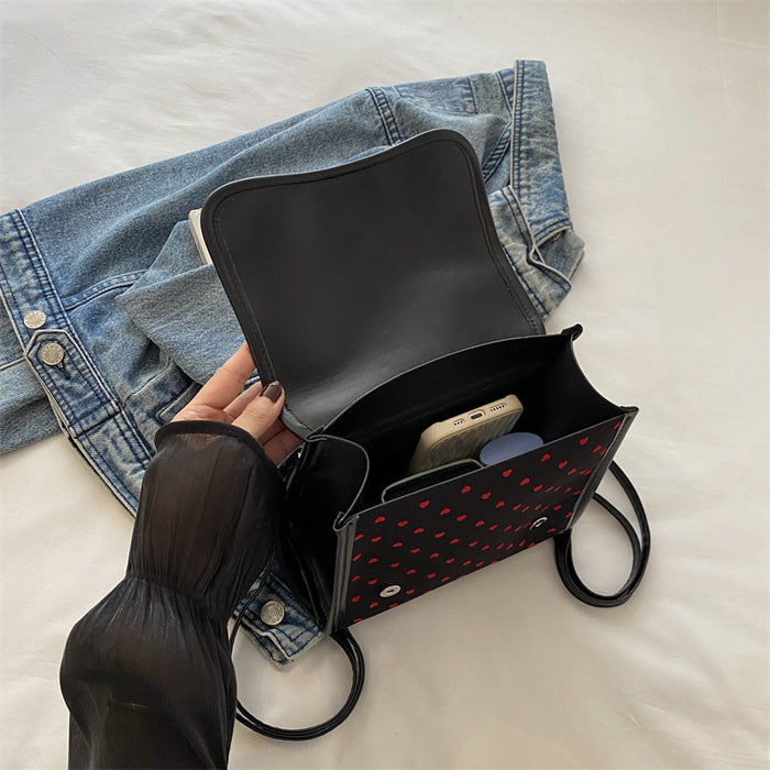 Wholesale Casual and fashionable handbag with heart-shaped printed canvas shoulders