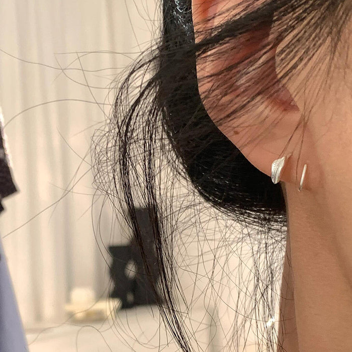 Wholesale Compact and minimalist leaf earrings with delicate and niche design, featuring metal leaf earrings