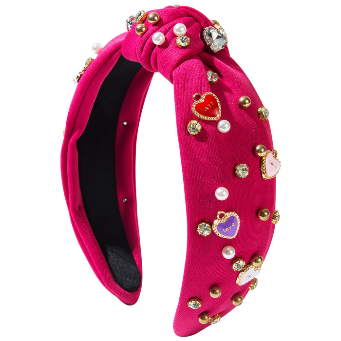 Wholesale Valentine' s Day headband with pearl-encrusted alloy letter and heart-shaped embellishments
