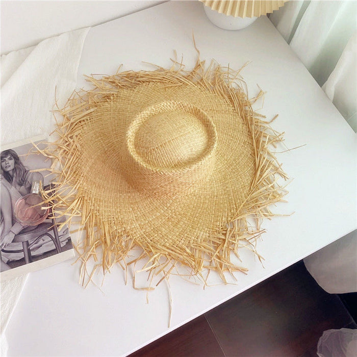 Wholesale Big brim frayed Lafite grass hat women's beach hat for beach vacation, sun protection and sunshade hat