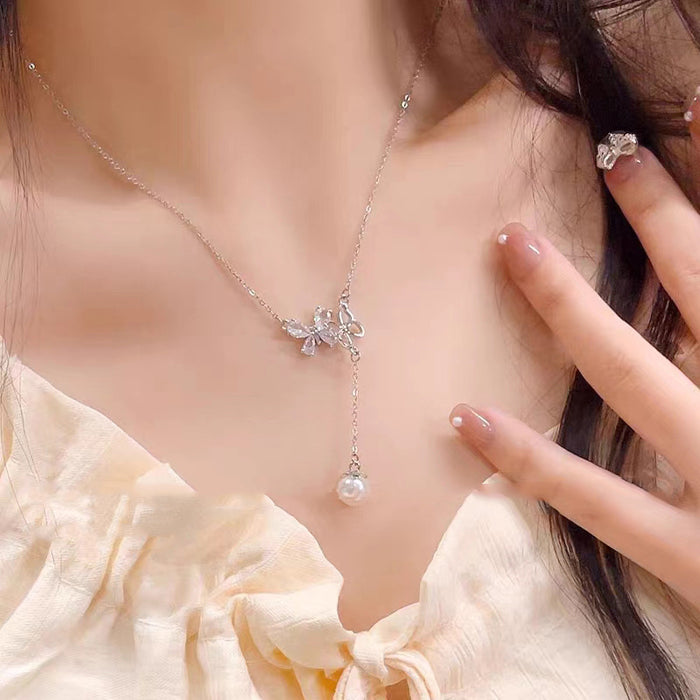 Wholesale Titanium steel micro inlaid jewelry hollow butterfly collarbone chain pearl tassel pendant light luxury accessory