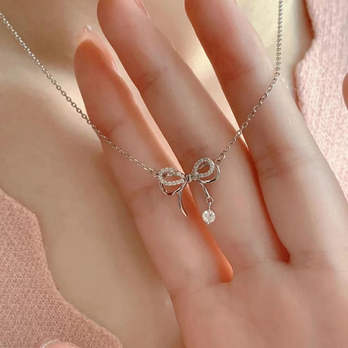 Wholesale Double layered bow necklace with niche design and versatile water droplet tassel collarbone chain pendant