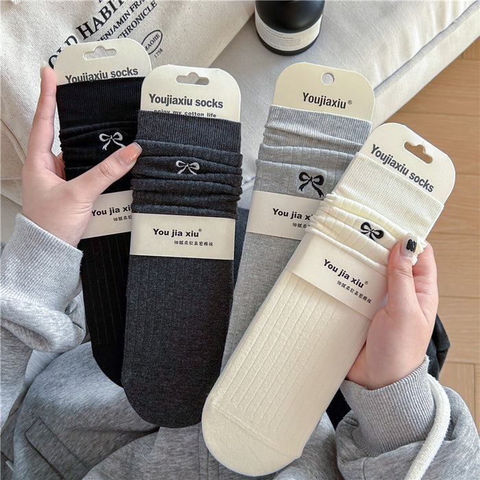 Wholesale Butterfly knot embroidered socks, solid color boneless pile socks, white socks