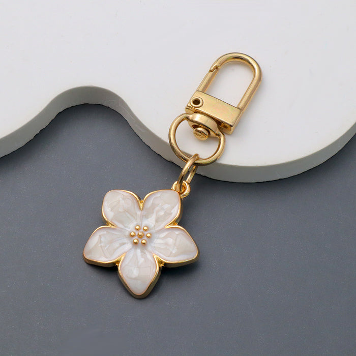 Wholesale Simple Dropping Oil Cherry Blossom Pendant Keychain Alloy Daisy Flower