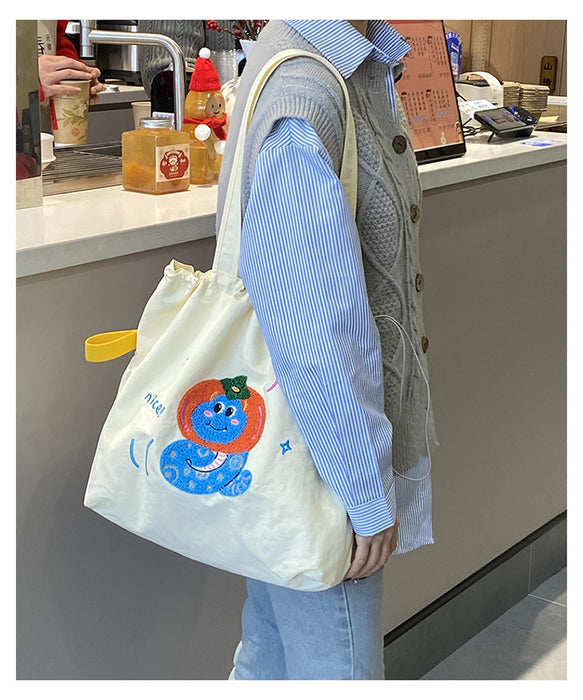 Wholesale Niche cartoon embroidered shoulder bag, simple and large capacity drawstring canvas bag, commuting tote bag for work