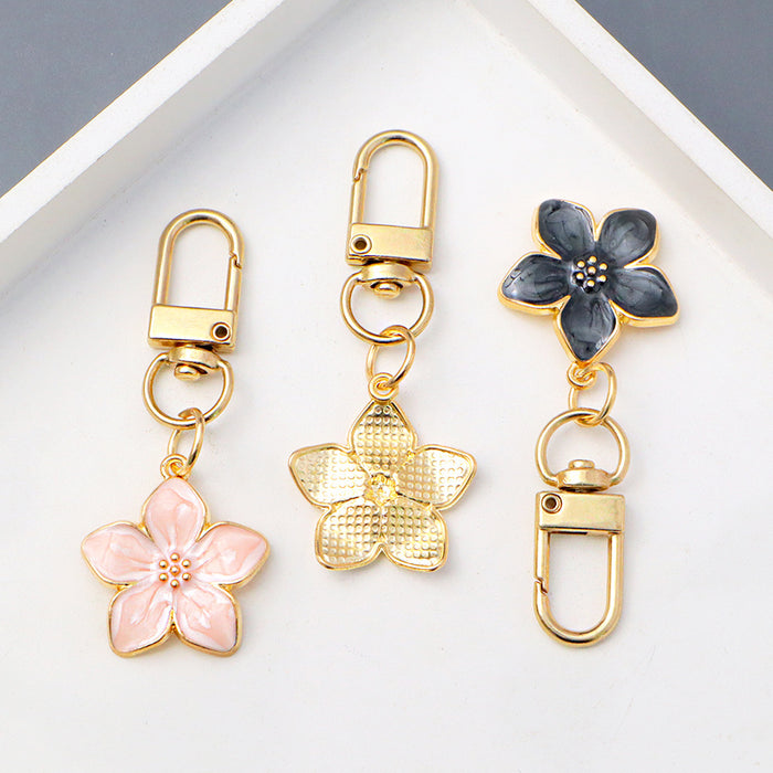 Wholesale Simple Dropping Oil Cherry Blossom Pendant Keychain Alloy Daisy Flower