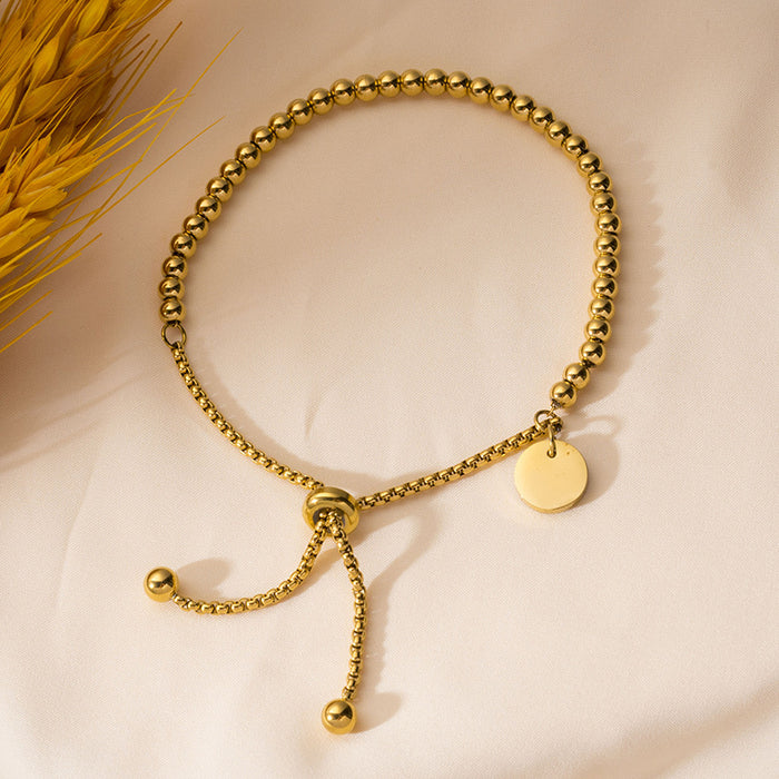 Wholesale Fashionable stainless steel bracelet with simple and fashionable circular hang tag, adjustable round bead, personalized pull-out bracelet