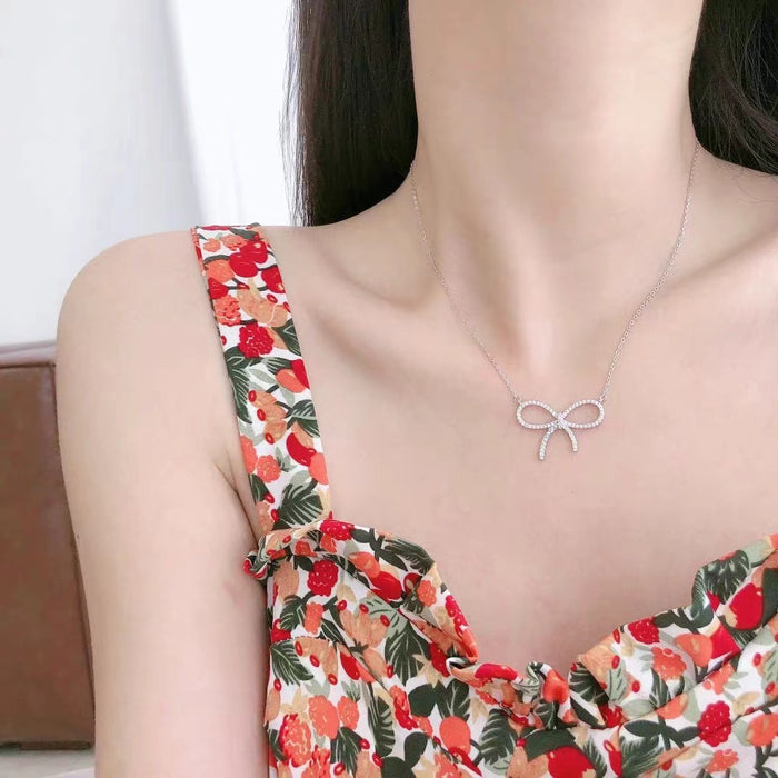 Wholesale Titanium steel necklace with high-end feel, full diamond bow pendant, light luxury, niche collarbone chain