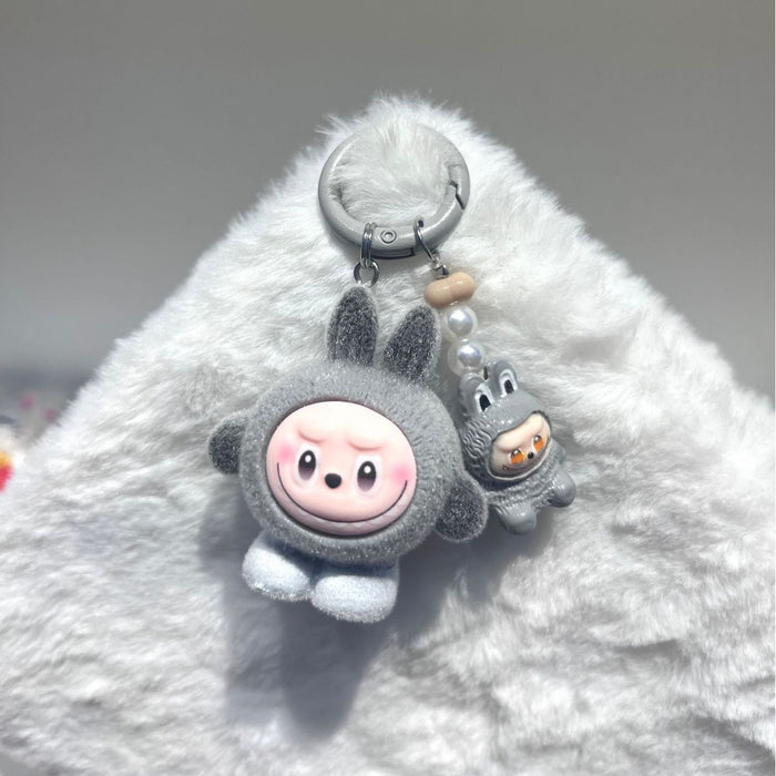Wholesale Flocked egg boy pull cloth high value cute mini doll ornaments pendant three-dimensional resin accessories