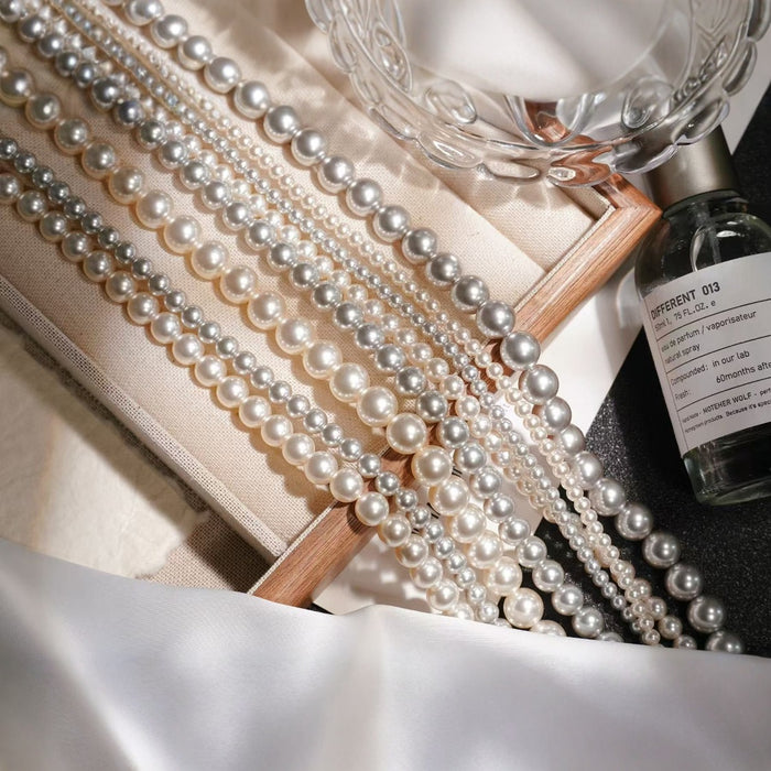 Wholesale Pearl titanium steel necklace, women's round, light luxury temperament, versatile autumn and winter sweater chain