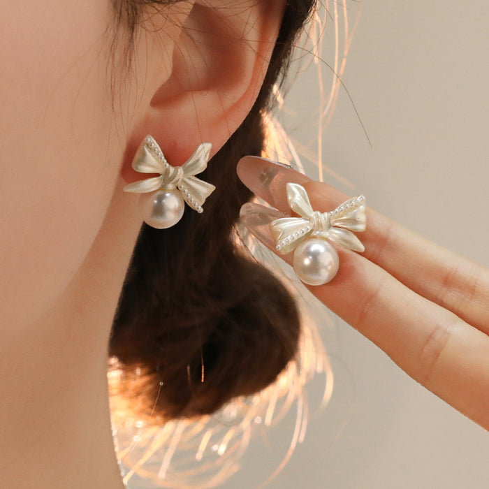 Wholesale White copper silver needle bow lily of the valley pearl earrings women's screw buckle