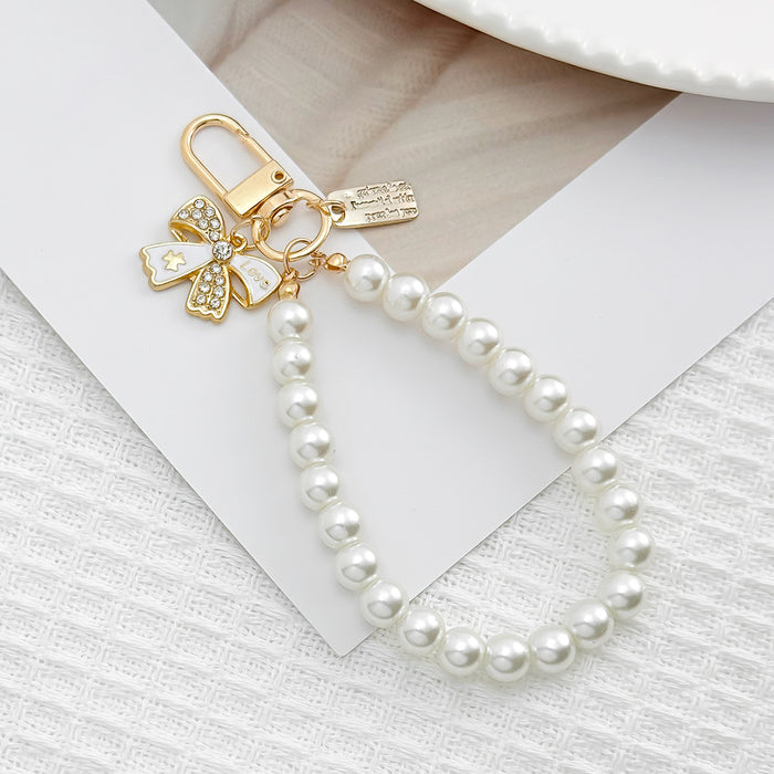 Wholesale Pearl chain beaded mobile phone lanyard bow pendant keychain