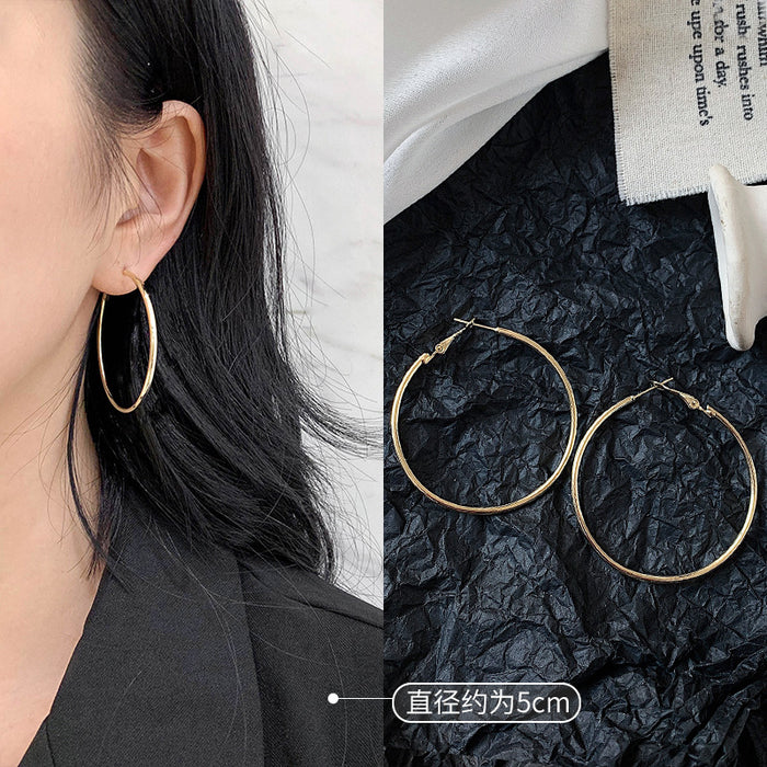 Wholesale Pure silver earrings with large circles, plain circles, and high-end feel. Round circle earrings