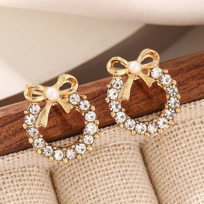 Wholesale Simple pearl bow earrings with personalized temperament, inlaid with colored diamonds, hollowed out circular earrings, and earrings