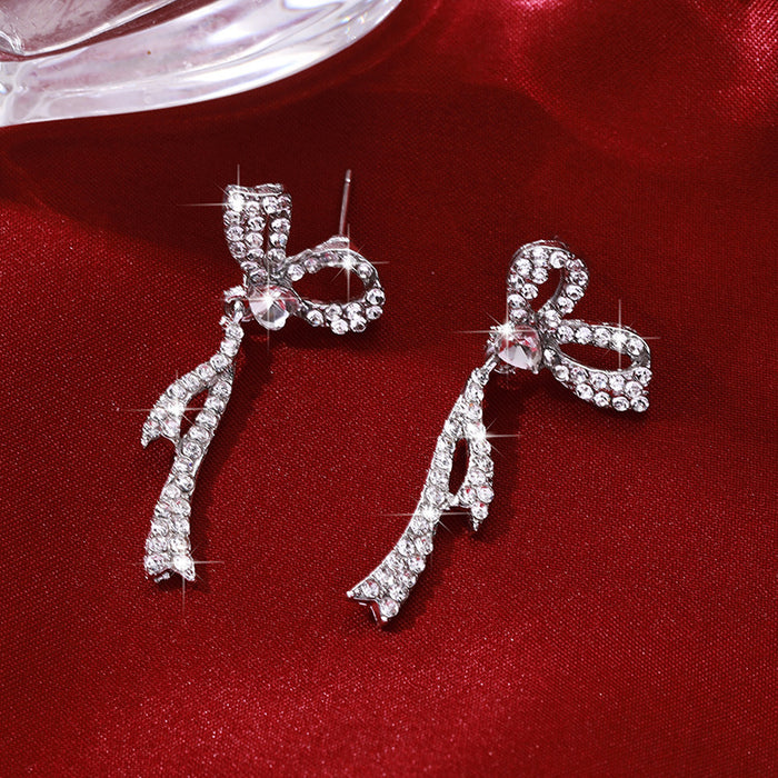 Wholesale Silver needle bow tassel earrings for women