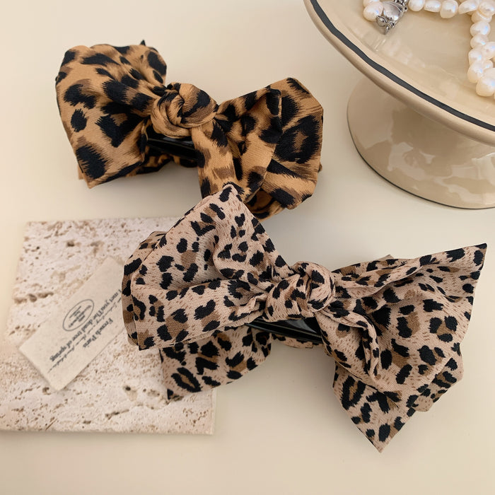 Wholesale Leopard print bow ball head clip female retro high ponytail fixed hairpin back of the head hair shark clip