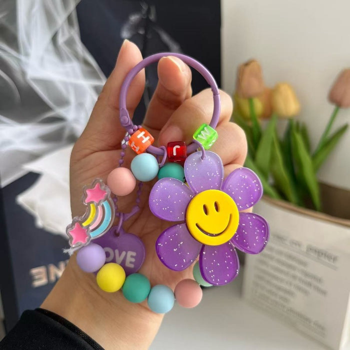 Wholesale Cute letter sunflower bag pendant with smiling face, colorful handmade bead key chain
