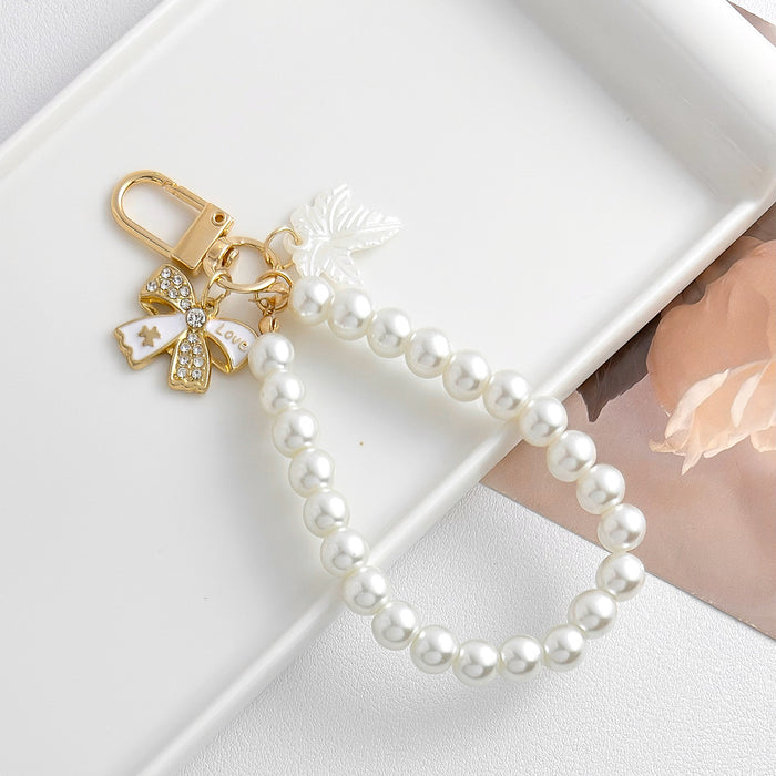 Wholesale Pearl chain beaded mobile phone lanyard bow pendant keychain