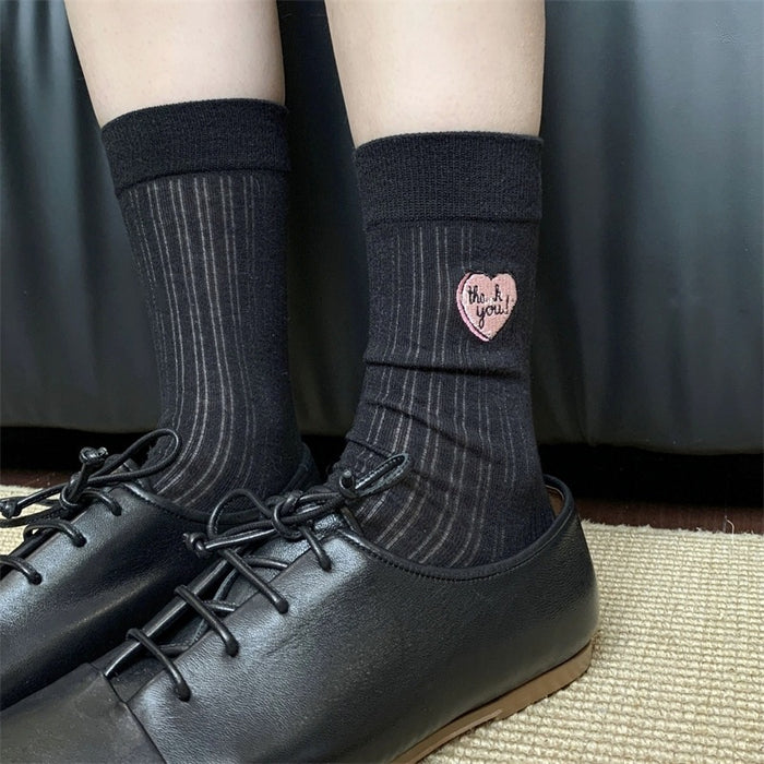 Wholesale Hollow out thin heart-shaped embroidered socks in a pile, tube socks