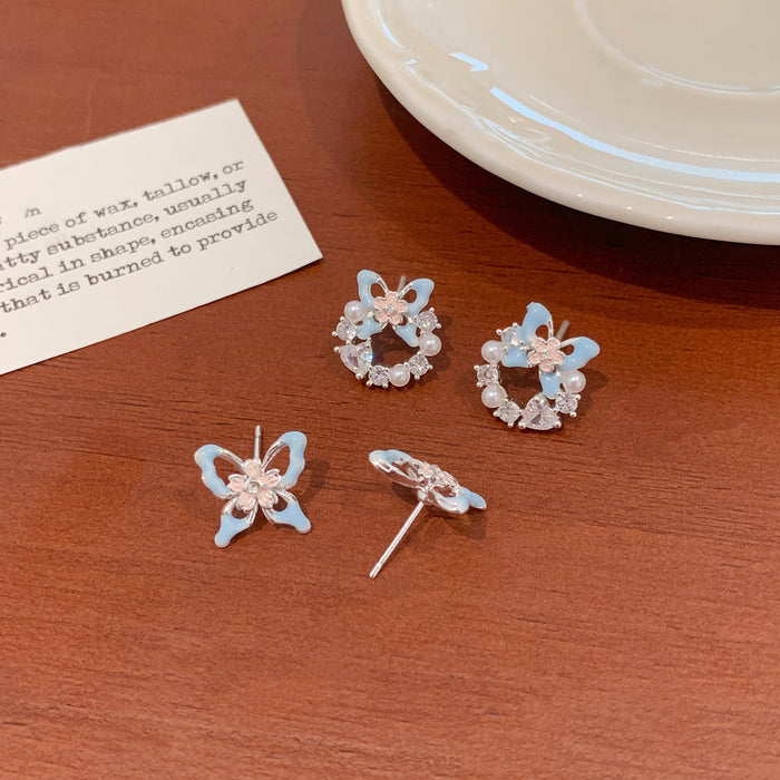 Wholesale Sweet and exquisite butterfly cherry blossom pearl earrings with silver needles, niche design, high-end and versatile earrings