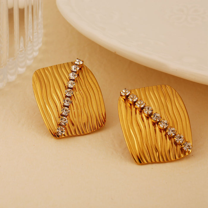 Wholesale Fashionable and personalized stainless steel zircon inlaid earrings and rings set, temperament earrings and bracelets
