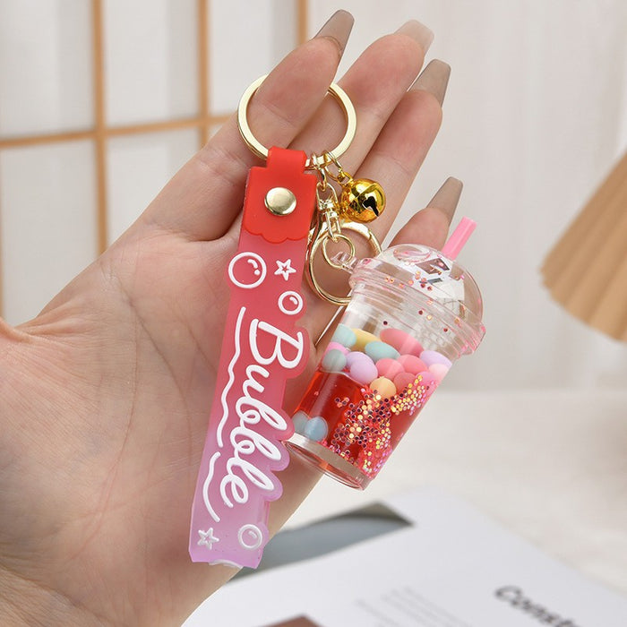 Wholesale Acrylic oil bottle candy Bean astronaut keychain